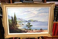 Framed oil painting front view on shelf