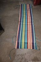 Cushion laid flat showing full length and tie straps
