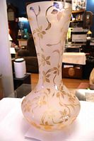 Full view of vase showing overall form and gold vine pattern
