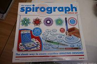 Front of Spirograph deluxe set box displaying contents and graphics