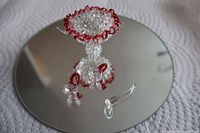 full set on mirror: punch bowl, two cups, ladle