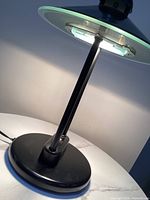 Lamp illuminated on table showing LED and structure