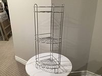 Front view of chrome 3-tier corner shower caddy