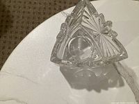 Triangular cut glass votive holder top view