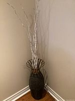 Full view of wicker vase with branches