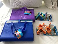 Overview of two folded mats and two packaged clip sets