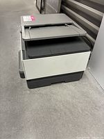 Angled view from left side displaying document feeder and overall body condition