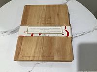 Front view of wood cutting board with product band