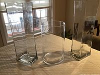 Front view of all three vases standing on table