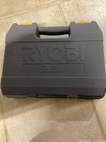 Closed grey Ryobi 9.6V hard case