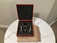 Closed wooden box on cardboard sleeve showing set packaging