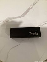 Closed black Verdici Design logo box