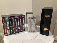 Overview of all three VHS sets on table