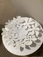 Top view of white metal floral cutout bowl