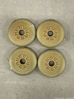 Four York Barbell plates top view showing branding and condition