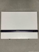 Front view showing white board surface and purple straightedge bar