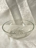side view of clear glass bowl showing transparency and shape