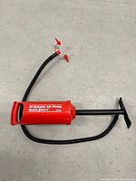 Full view of red Intex Double Quick II pump with hose and handle