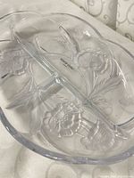 Top view showing full platter shape and embossed floral design