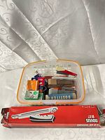 Basket with staple boxes and boxed large stapler