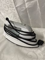 Left side view of Sunbeam iron with cord wrapped