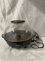 Overall view of Toastess Cinema Popper showing base, clear dome and cord