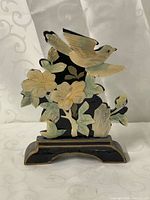 Front view of lacquer screen showing bird and flower inlay