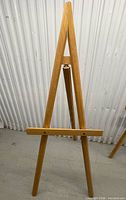 Front view of wooden easel standing