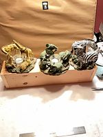 All three animal tealight holders side by side on table