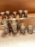 Full group of nine pewter vessels
