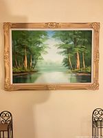 Full view of framed oil landscape painting
