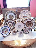 Group shot of all eleven commemorative plates