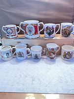 All eight mugs and loving cups displayed front and top view