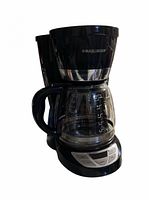 Front three-quarter view of coffeemaker showing brand logo, carafe and overall condition
