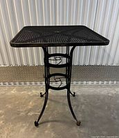 Full view of square wrought iron bistro table