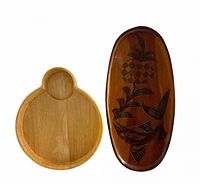 Front view of both boards showing dip section and carved motif