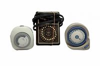 Front view of all three timers showing dials and overall design