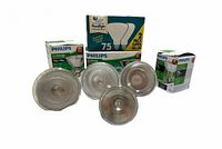 Front view showing four bulbs and three boxes (Philips EcoVantage single boxes and SLI International two-pack box)