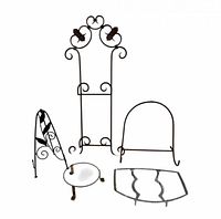 Group shot of five metal stands including tall easel, small easel, round trivet, semicircle cradle, Corning cradle