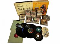 Group shot showing vinyl LPs, 45 singles, CDs, cassette tapes and boxed set