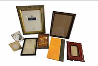 All eight picture frames laid out to show fronts, materials and relative sizes