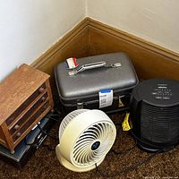 Group view of fan, Honeywell unit, vanity case, mini chest, cables