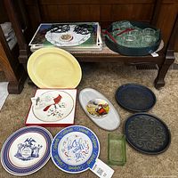 Overall lot showing placemats, tray with glasses, assorted plates on floor