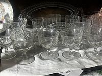 Group of clear stemmed glasses and platter