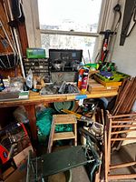 Workbench view with toolbox, parts organizer, lubricant cans, fasteners, stool, kneeler, twine