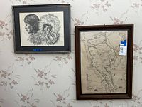 Overall view of both framed artworks on wall