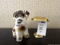 Dog figurine and mini bankers lamp on tabletop