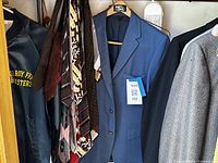 Clothing rod with jackets, sport coats, neckties