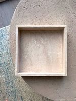 Top view of square beige ceramic tray