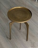 Full view of bronze aluminum tripod side table